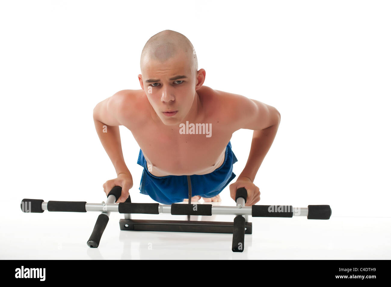 skinny-male-teenager-working-out-C4DTH9.jpg