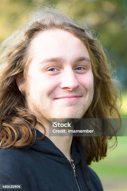 portrait-of-18-years-old-young-man-with-long-hair.jpg