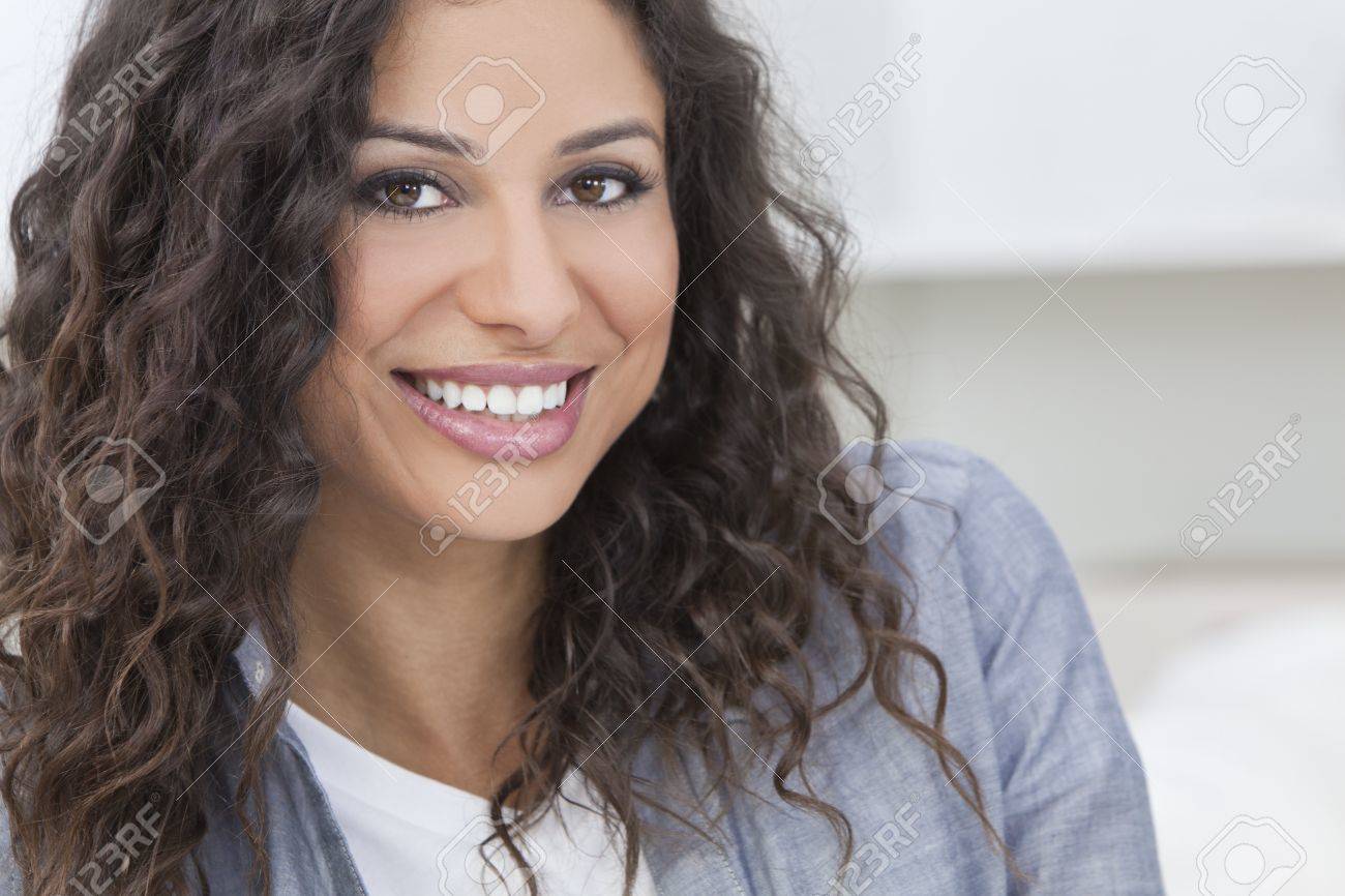 13845338-studio-portrait-of-a-beautiful-young-latina-hispanic-woman-smiling.jpg