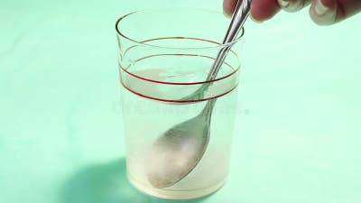 mixing-glass-spoonful-sugar-drinking-water-mixing-glass-spoonful-sugar-drinking-water-close-199926102.jpg