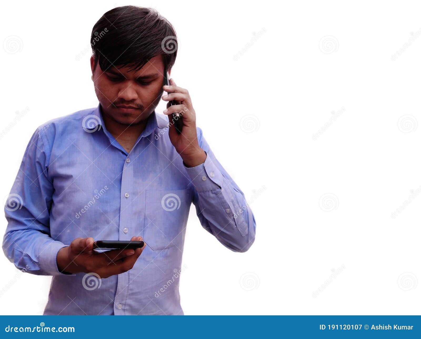 Man Using Two Mobile Phones Talking and Typing on Cell, Indian Men in Blue  Sthit Isolated on White Background Stock Image - Image of outdoor,  lifestyle: 191120107